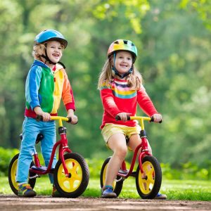 kids ride bike in a park - kids ride wild